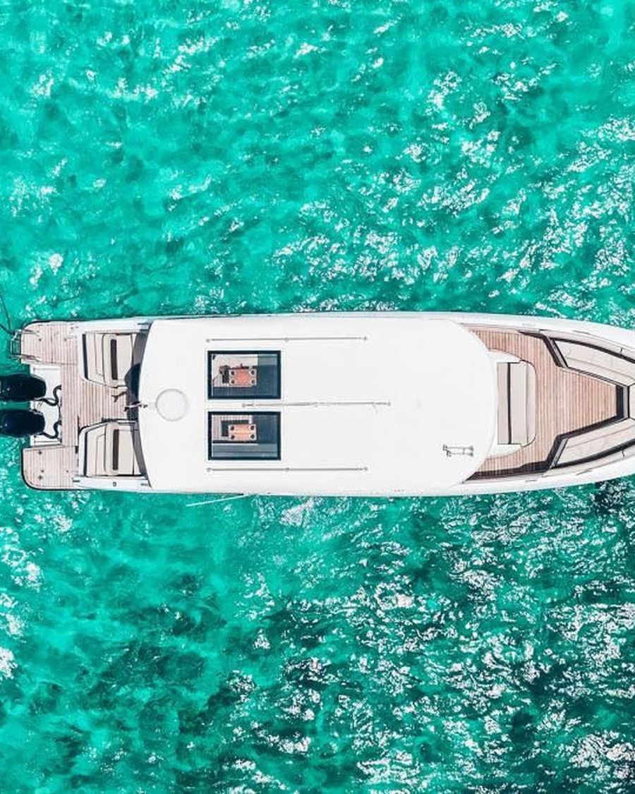Aerial view of a yacht on turquoise water